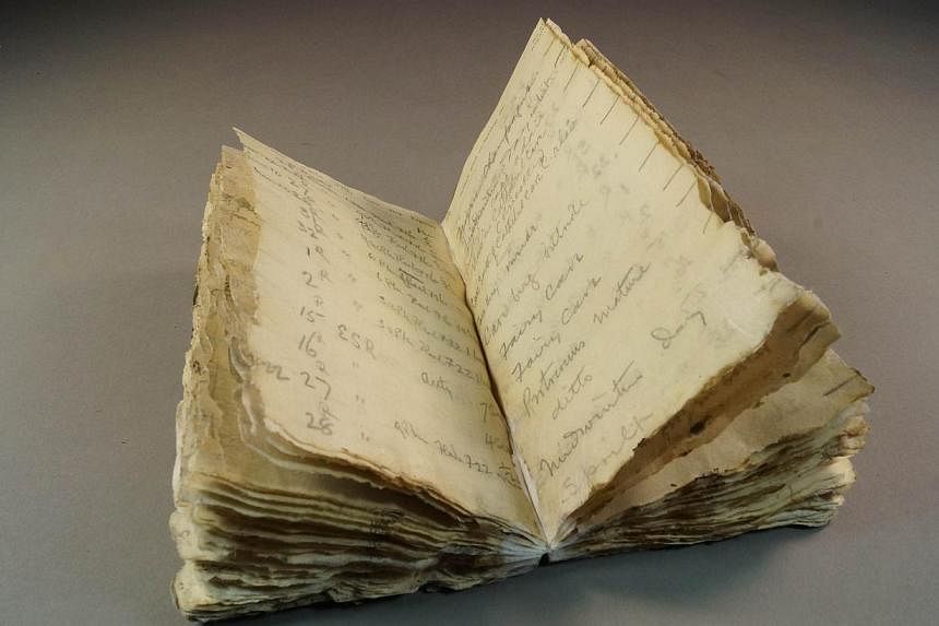An undated handout photo from Antarctic Heritage Trust (NZ), released on Oct 23, 2014 shows a notebook from Robert Scott's ill-fated Antarctic expedition which was found after a century trapped in the ice of the frozen continent. -- PHOTO: AFP