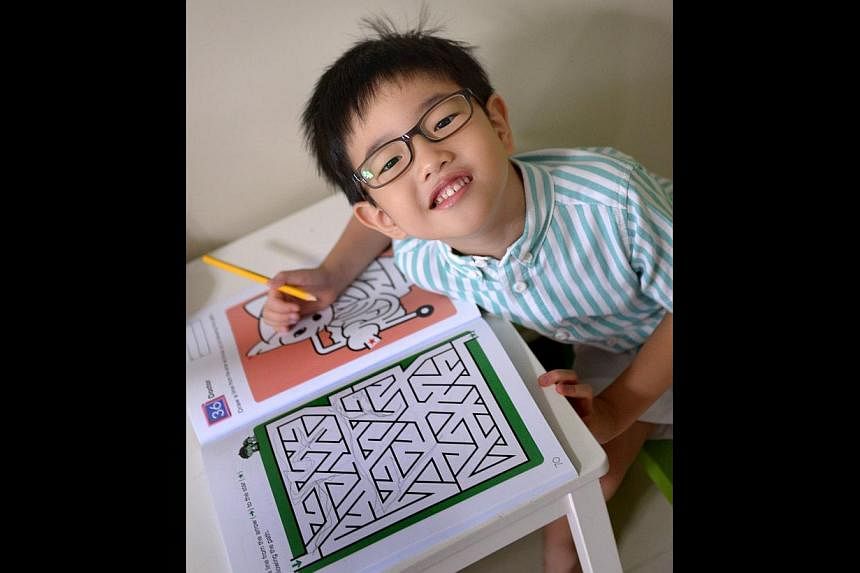 Five-year-old Xavier Lim is among a growing number of young children with problems such as myopia or astigmatism.