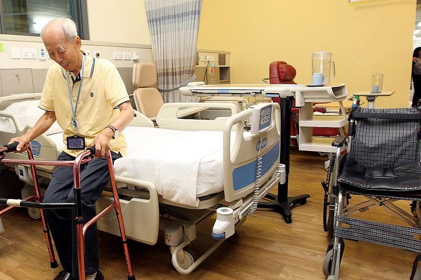 A stroke patient using crutches to go to the toilet from the hospital bed of a ward. -- PHOTO: ST FILE