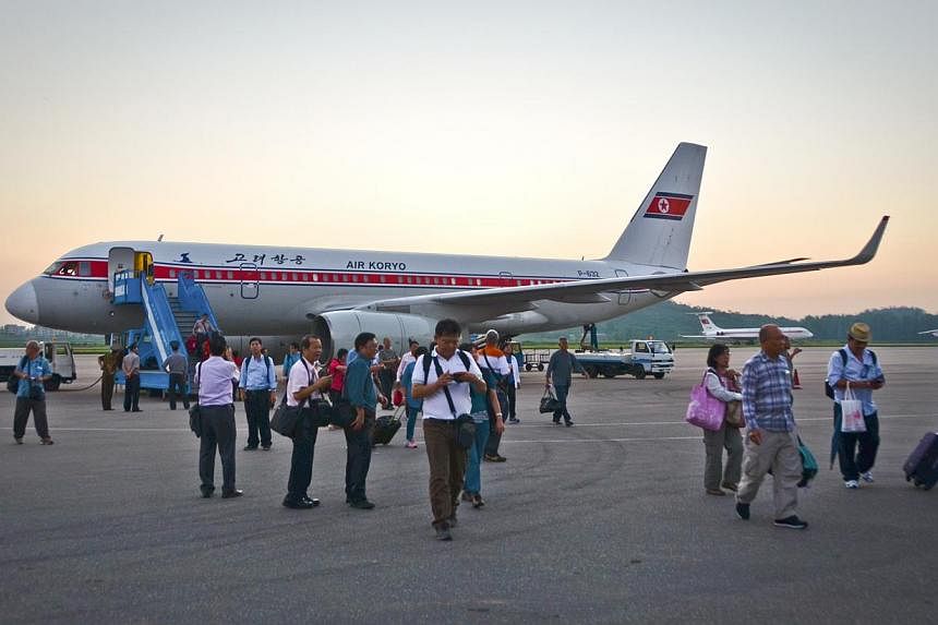 Travelers at the airport in Pyongyang, North Korea.&nbsp;North Korea will bar entry to foreigners on tourist trips from Friday, because of worries over the spread of the deadly Ebola virus, operators of tours to the isolated country said. -- PHOTO:&n