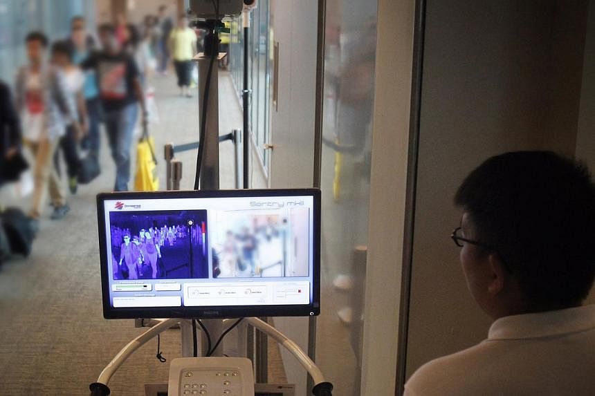 While the risk of an Ebola outbreak in Singapore is low, the possibility of cases being imported here cannot be ruled out given that the Republic is an air hub, said Prime Minister Lee Hsien Loong. -- PHOTO: ST FILE
