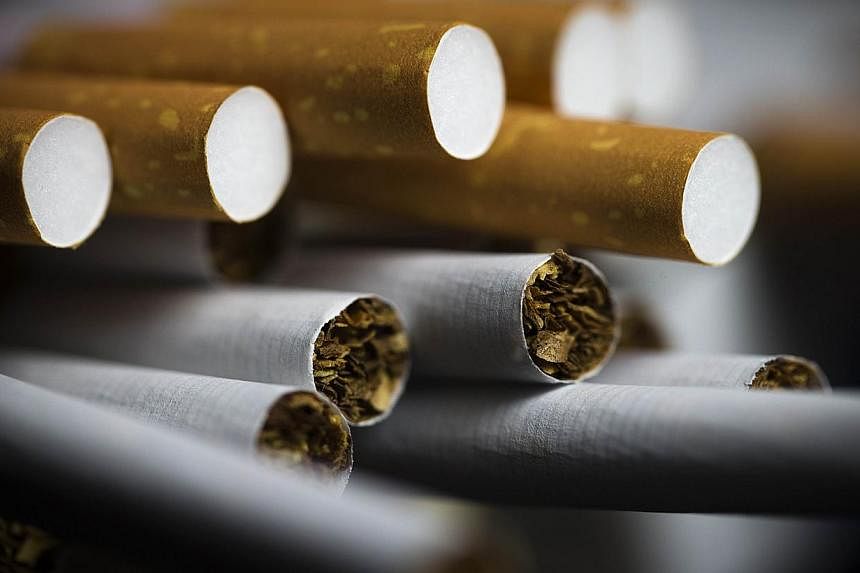 The second largest tobacco producer in the United States, Reynolds American said on Oct 23 it will ban smoking in all indoor office spaces, bowing to smoke-free social norms. -- PHOTO: AFP