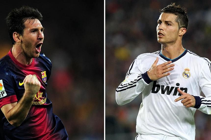 Barcelona's Lionel Messi (left) and Real Madrid's Cristiano Ronaldo will be pumped up for the 229th El Clasico on Saturday, where Luis Suarez could make his Barca debut. -- PHOTO: AFP&nbsp;