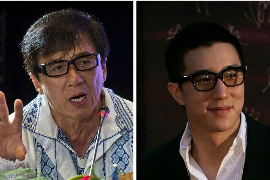 Speaking to reporters about his son Jaycee's (right) drug arrest for the first time, action star Jackie Chan on Thursday begged them not to hurt his wife Lin Feng-jiao with speculative reports. -- PHOTOS: REUTERS, AFP&nbsp;
