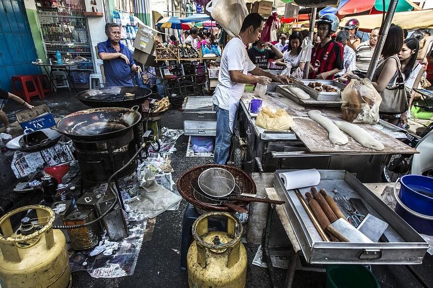 Street food hawkers in Penang, Malaysia. Penang has banned foreign workers from working as cooks in hawker food stalls, in an attempt to preserve the state's food heritage, Malaysian media reported. -- PHOTO: MARK ONG&nbsp;