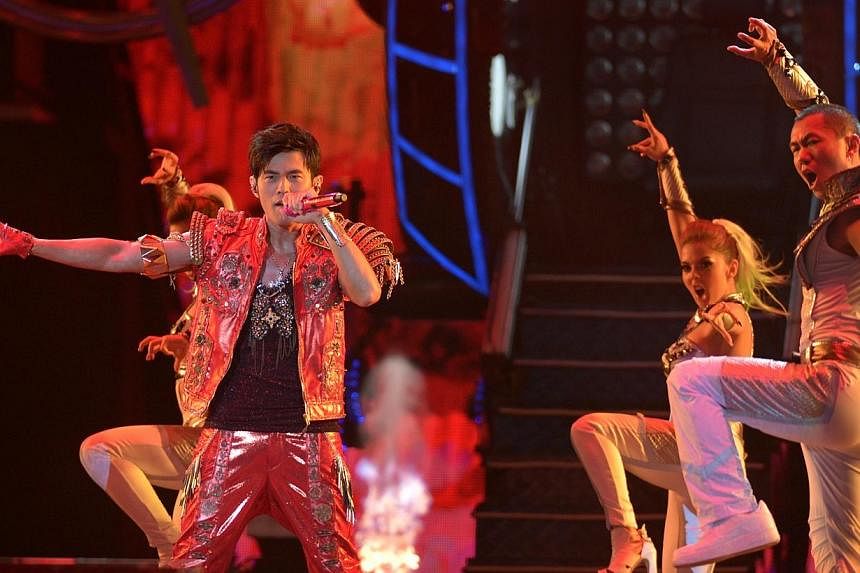 Taiwanese singer Jay Chou performing on stage in one of the three sold-out concerts held at the Singapore Indoor Stadium on June 6, 2013.&nbsp;-- PHOTO: ST FILE