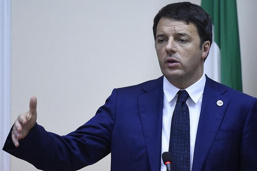 Italian Prime Minister Matteo Renzi gives a press conference after a meeting between Russia's President Vladimir Putin and Ukraine's President Petro Poroshenko on Ukraine's crisis on Oct 17, 2014, on the sidelines of the 10th ASEM summit in Milan. --