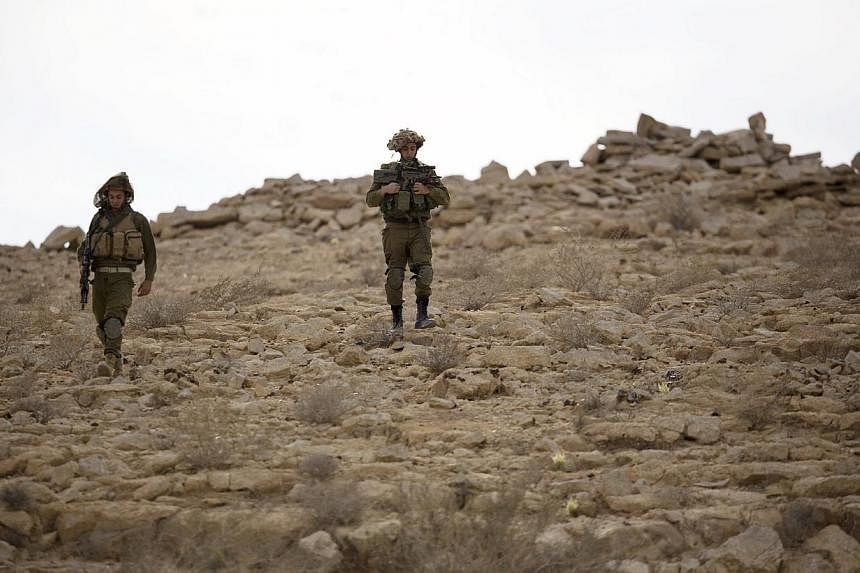 Israeli soldiers patrol the area near the Israeli-Egyptian border on Oct 22, 2014. -- PHOTO: REUTERS