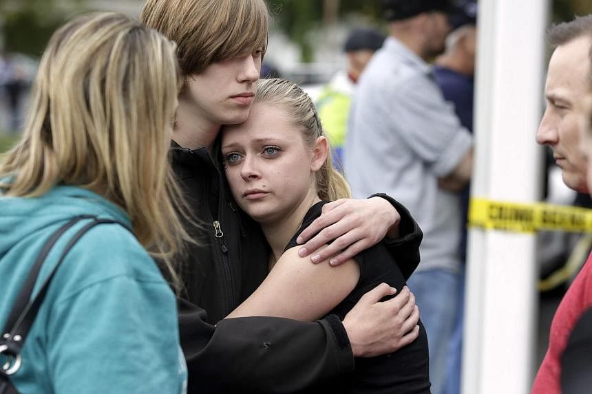 Students and family members reunite at Shoultes Gospel Hall after a student opened fire at Marysville-Pilchuck High School in Marysville, Washington on Oct 24, 2014. -- PHOTO: REUTERS