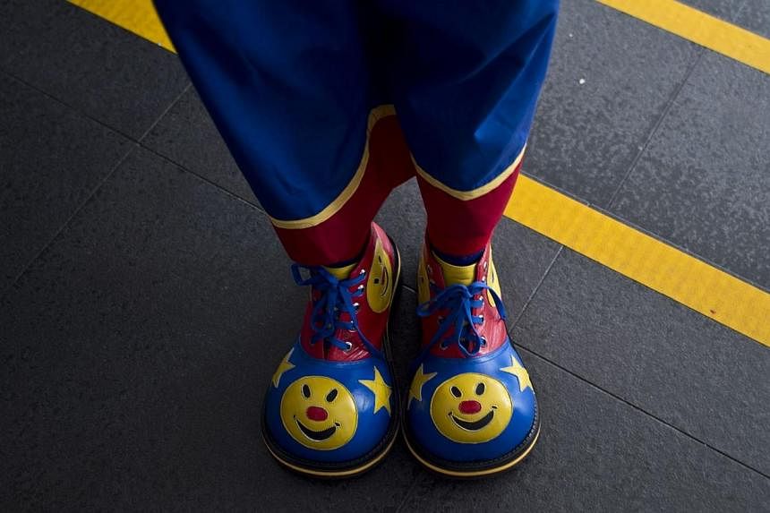 A wave of panic sparked by evil clowns stalking French towns has spread to the south of France where police on Saturday night arrested 14 teenagers dressed as the pranksters, carrying pistols, knives and baseball bats. -- PHOTO: AFP