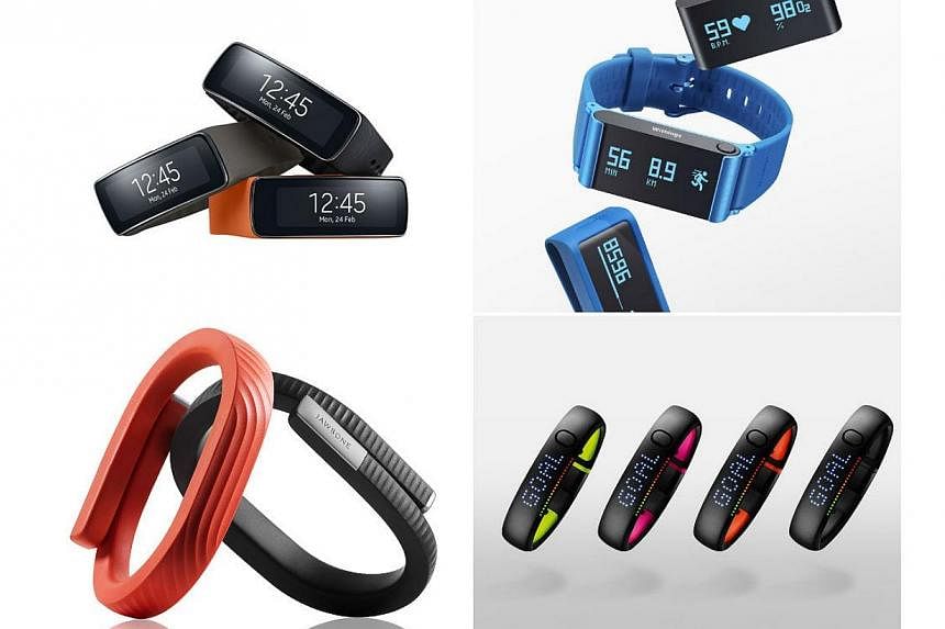 Gadgets that can help you keep fit and keep track of your calories: (clockwise, from top left) Samsung Gear Fit, Withings Pulse O2, Jawbone Up24 and Nike+ FuelBand SE. -- PHOTOS: SAMSUNG/WITHINGS/JAWBONE/NIKE INC