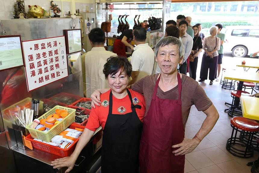 Madam Betty Kong (left, with her husband Ha Wai Kay). Their two children did not want to continue the business. -- ST PHOTO: SEAH KWANG PENG
