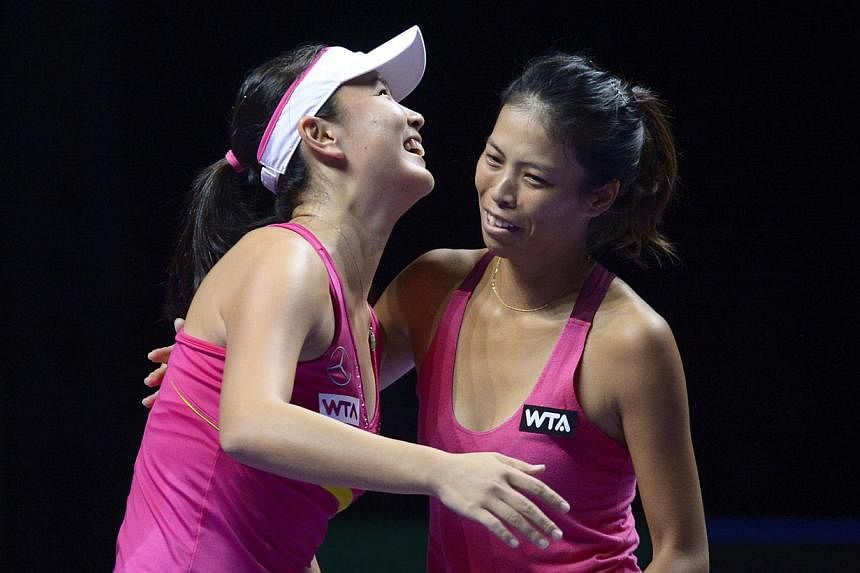 Peng Shuai (left) celebrates with doubles partner Hsieh Su-wei after winning their WTA Finals semi-final clash with Alla Kudryavtseva and Anastasia Rodionova.