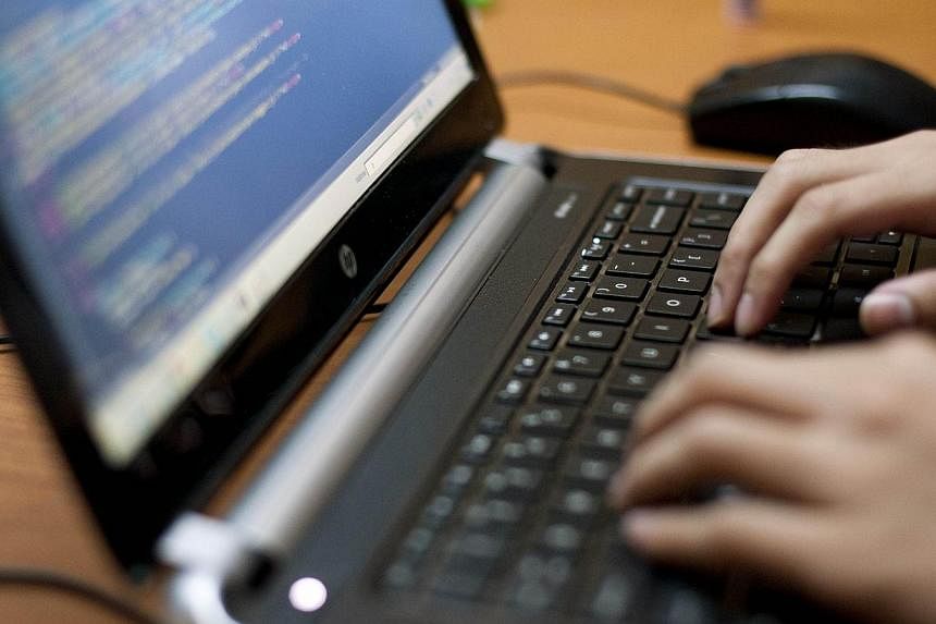Britain is the first major world economy to make coding a compulsory subject for children in publicly-funded schools from the age of five. -- ST PHOTO: YE AUNG THU