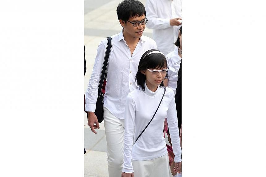 Bloggers Han Hui Hui, 22, and Roy Ngerng, 34 appeared in court on Monday to face charges of causing public nuisance and organising a demonstration without approval, during the YMCA charity carnival at Hong Lim Park, on Sept 27. -- ST PHOTO: WONG KWAI