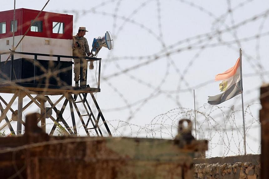 An Egyptian soldier mans a watch tower on the Egyptian side of the Rafah border crossing in the southern Gaza Strip&nbsp;on Oct 26, 2014. Egyptian President Abdel Fattah al-Sisi on Monday enacted a decree allowing military trials for civilians suspec
