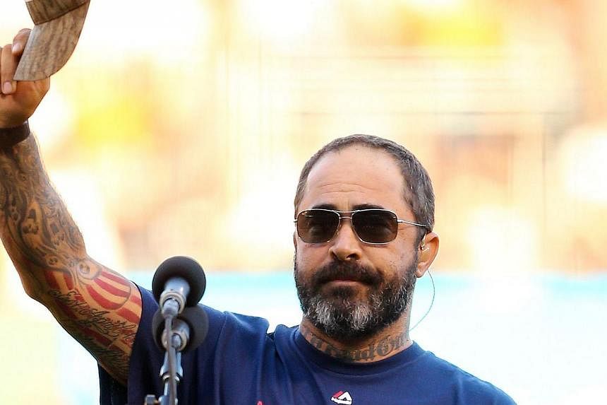 Singer Aaron Lewis performs the national anthem prior to Game Five of the 2014 World Series between the San Francisco Giants and the Kansas City Royals at AT&amp;T Park in San Francisco, California&nbsp;on Oct 26, 2014. -- PHOTO: AFP