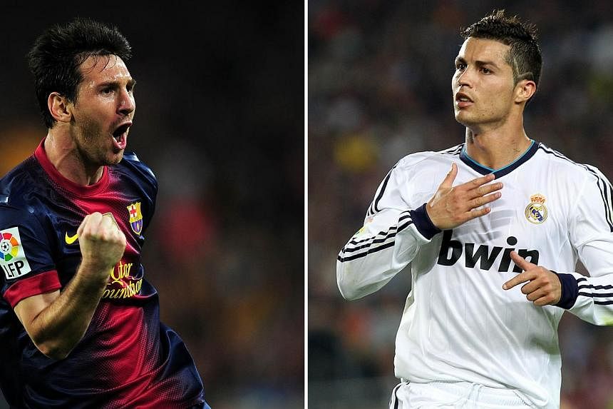 Days after their El Clasico showdown, Real Madrid's Cristiano Ronaldo and Barcelona's Lionel Messi will do battle again - this time for the Fifa World Player of the Year award, the Ballon d'Or. -- PHOTO: AFP