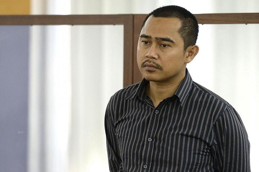 Malaysian diplomat Muhammad Rizalman Ismail, charged with attempted rape, stands in the dock at the Wellington District Court New Zealand on Oct 28, 2014. -- PHOTO: AFP