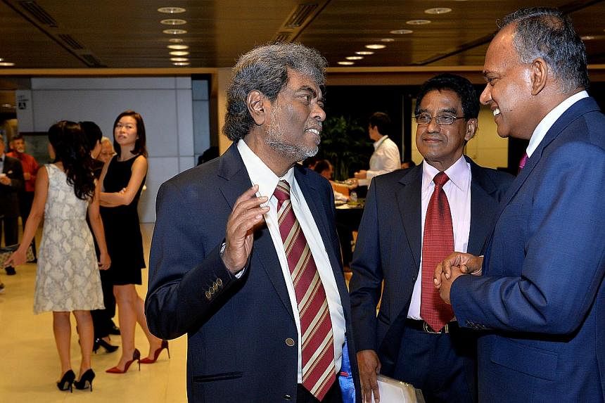 From Left: criminal lawyer Subhas Anandan talking to Noor Mohamed Marican , President of Association of Muslim Lawyers and Mr K Shanmugam, Minister for Law and Foreign Affairs at the reception.&nbsp;Ex-convicts released from prison will soon get fina