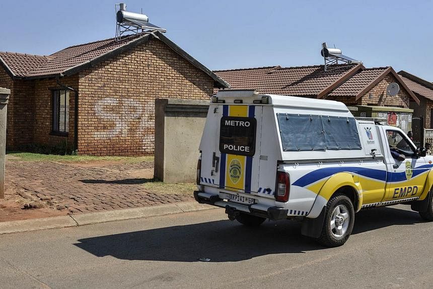 A police van patrols in front of the house where Orlando Pirate and Bafana Bafana goalkeeper Senzo Meyiwa was murdered last night on in Johannesburg on Oct 27, 2014. -- PHOTO: AFP