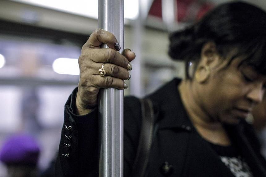 A woman rides the New York subway. The city has been rated as having the safest transport system for women, compared with 15 of the world's largest capitals. -- PHOTO: AFP&nbsp;