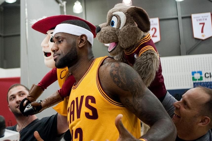 Cleveland Cavaliers forward LeBron James (23) does an interview with Sir CC and Moondog during media day at Cleveland Clinic Courts.&nbsp;-- PHOTO: KEN BLAZE-USA TODAY SPORTS