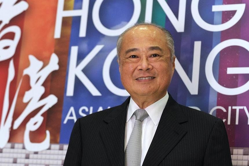 Hong Kong Exchanges and Clearing chairman Chow Chung-kong poses in Paris during the "Think Asia, Think Hong Kong" event on Oct 28, 2014 in Paris.&nbsp;-- PHOTO: AFP