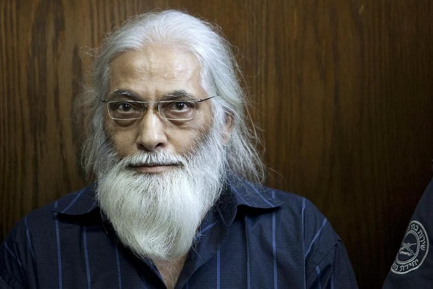Goel Ratzon sits in a Tel Aviv courtroom on Sept 8, 2014.&nbsp;An Israeli court sentenced the polygamist cult leader to 30 years in prison on Tuesday for multiple sexual offences including rape, indecent assault and incest, media reports said. -- PHO