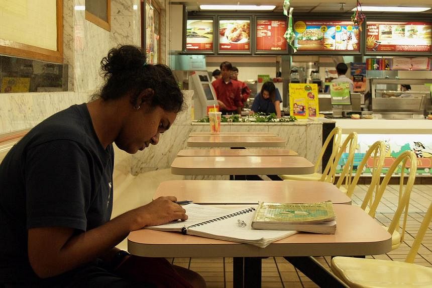 ST reporter Jalelah Abu Baker, then a student, studying at a McDonald's in 2005. -- PHOTO: ST FILE