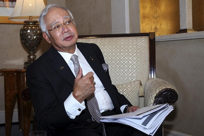 Malaysia's Prime Minister Najib Razak speaks to Reuters during the 10th World Islamic Economic Forum in Dubai Oct 28, 2014. Mr&nbsp;Najib vowed to bring to justice the perpetrators of the downing of Malaysia Airlines MH17, but said he feared fighting