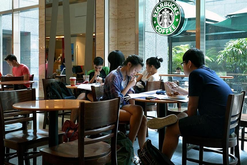 Customers studying in Starbucks' City Link Mall outlet on Oct 29, 2014.&nbsp;-- ST PHOTO:&nbsp;KUA CHEE SIONG