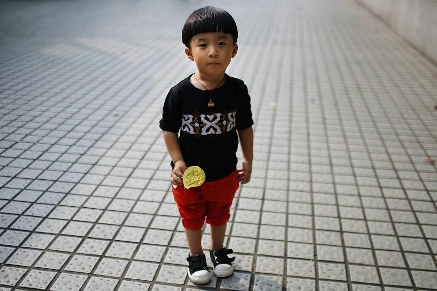 Far fewer Chinese couples applied to have a second child than expected after a relaxation of the country's "one child" policy, state-run media reported on Thursday, highlighting the ageing nation's demographic challenges. -- PHOTO: REUTERS