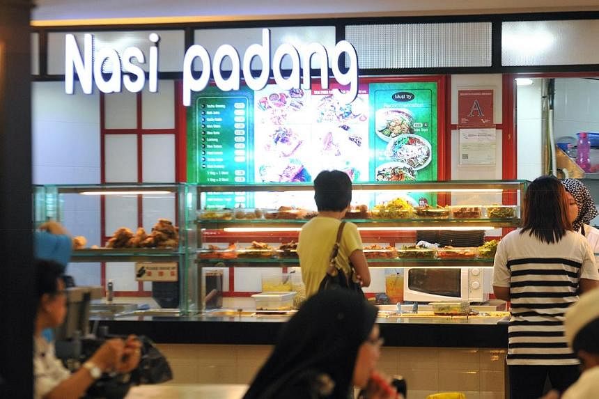 A four-year-old boy died four days after eating contaminated food bought from a nasi padang stall at a food court, a coroner's court heard. -- ST PHOTO: RUDY WONG