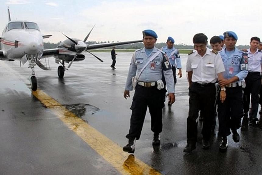 The plane carrying a Singaporean pilot and two foreigners had to land in Pontianak on Tuesday after being intercepted by the Indonesian Air Force.