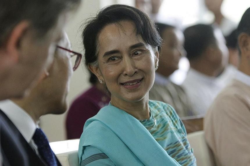 Myanmar opposition leader Aung San Suu Kyi, seen here (above) at an event outside Yangon on Oct 25, 2014, is expected to be among the&nbsp;heads of major political parties and ethnic groups who will meet with the government on Friday to discuss natio