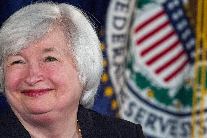 In this Sept 17, 20114 file photo, Federal Reserve Board chairman Janet Yellen speaks to the media during her monthly news conference at the Federal Reserve in Washington, DC.&nbsp;The Federal Reserve decided Wednesday to end its quantitative easing 