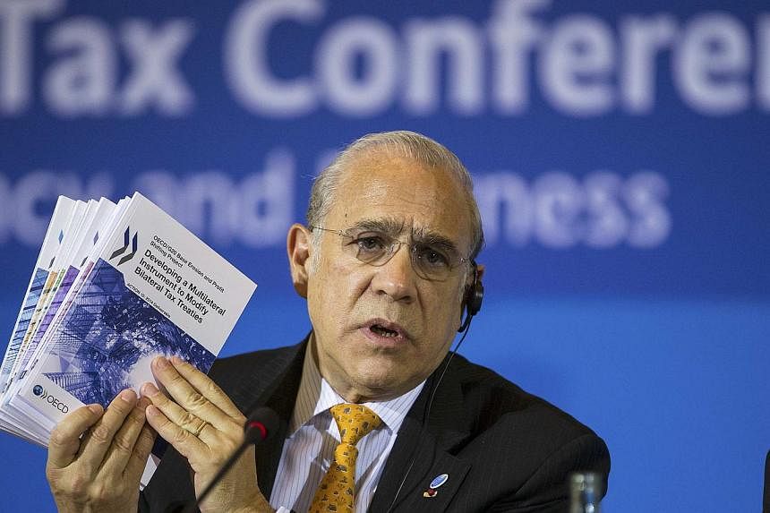 OECD secretary-general Angel Gurria addresses a news conference in Berlin Oct 29, 2014.&nbsp;Finance ministers and tax chiefs from 51 countries signed an agreement in Berlin on Wednesday to automatically swap tax information as part of the Organisati