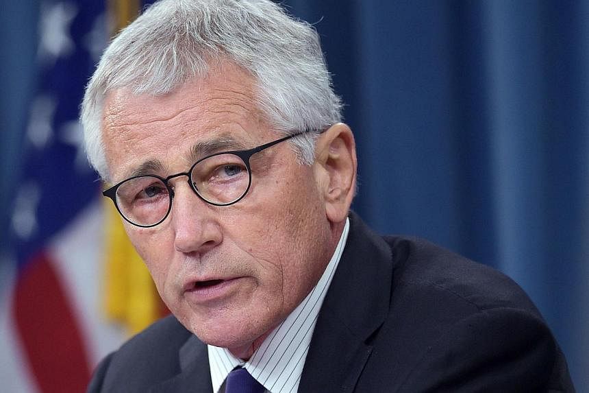 Pentagon chief Chuck Hagel (above, in a Sept 26 file photo) on Wednesday ordered a 21-day quarantine for all US troops returning from West Africa, calling it a "prudent" measure to prevent the spread of the Ebola virus. -- PHOTO: AFP