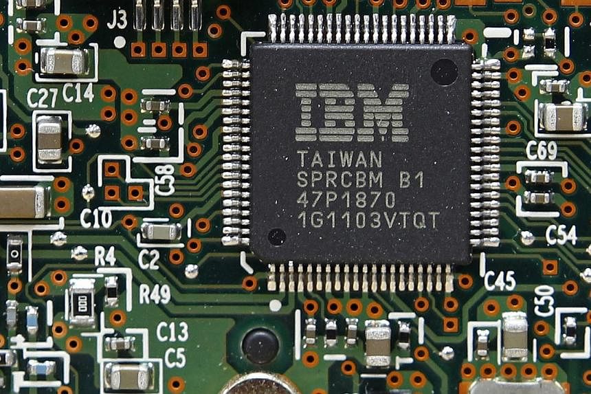 An IBM central processor unit is seen on a hard disk drive controller in Kiev, in this file photo from March 5, 2012. International Business Machines announced on Wednesday a partnership with Twitter to use data collected from tweets published around
