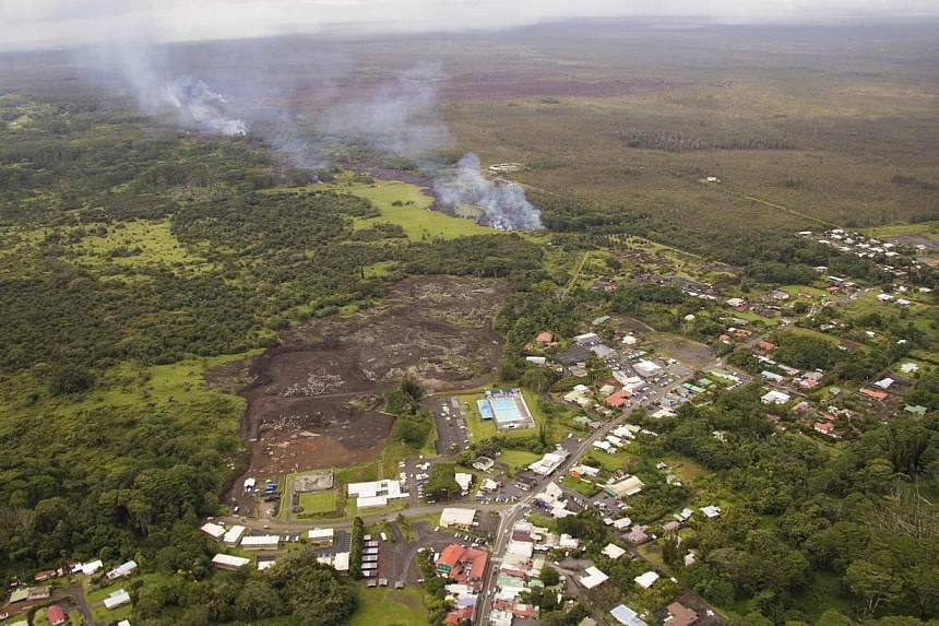 The lava flow from the Kilauea Volcano is seen nearing residential areas in a US Geological Survey (USGS) image taken near the village of Pahoa, Hawaii, on Oct 27, 2014. -- PHOTO: REUTERS