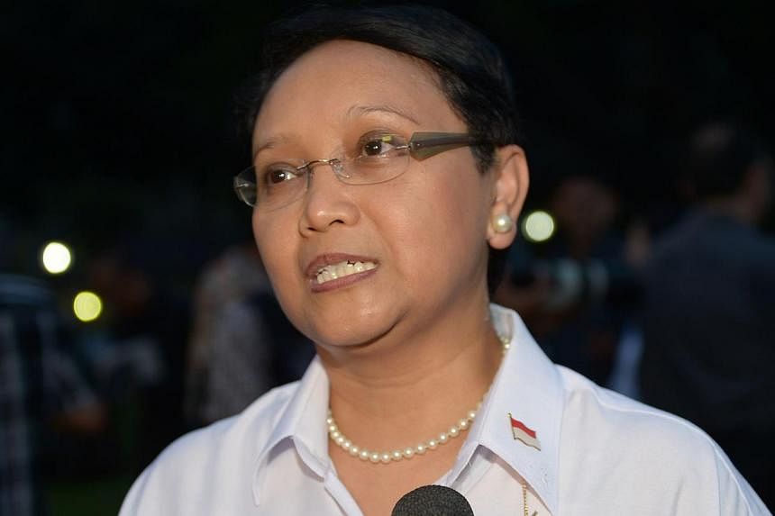 Indonesian Foreign Minister Retno Lestari Priansari Marsudi speaking to journalists after the Cabinet announcement at the presidential palace in Jakarta on October 26, 2014. She is the country's first female foreign minister, unveiled by Indonesian P