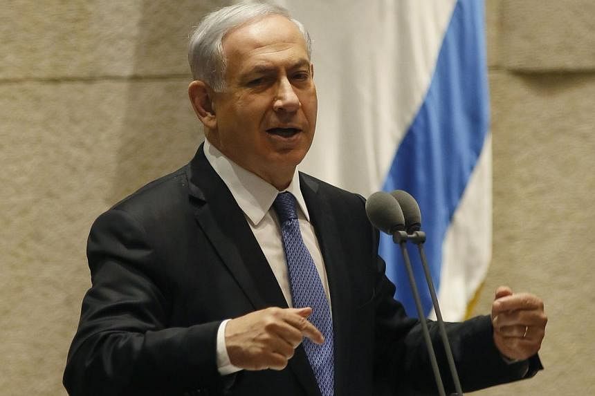 Israeli Prime Minister Benjamin Netanyahu gestures as he delivers a speech at the Knesset, Israel's parliament, on Oct 29, 2014 in Jerusalem. An article published online by The Atlantic magazine quoted officials of US President Barack Obama's adminis