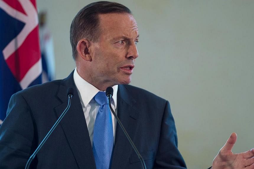 Australian Prime Minister Tony Abbott at a press conference in Putrajaya, outside Kuala Lumpur on Sept 6, 2014. -- PHOTO: AFP&nbsp;