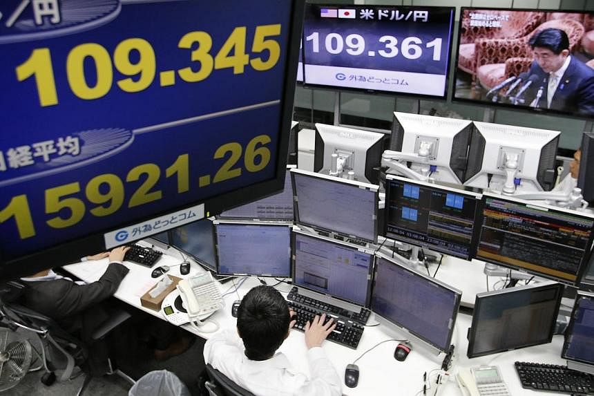Tokyo shares soared 4.83 per cent to a seven-year high on Friday after the Bank of Japan ramped up its vast monetary easing programme, sending the yen into freefall. -- PHOTO: REUTERS