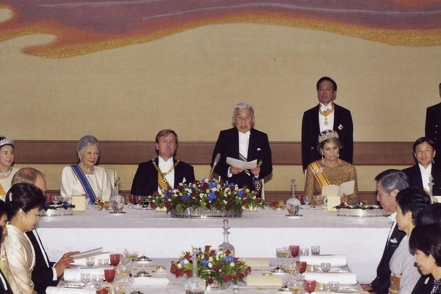 In this photograph released by the Imperial Household Agency of Japan on Oct 29, 2014, Japanese Emperor Akihito (centre) gives a speech to welcome Dutch King Willem-Alexander (third left) and Queen Maxima (second right, seated) as Empress Michiko (se