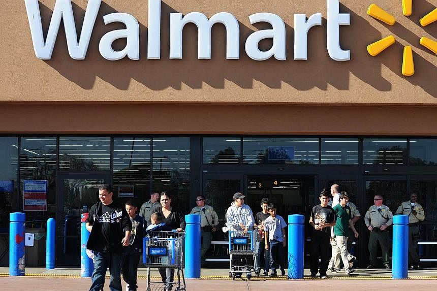 In this 2012 file photo, shoppers are seen in front of a Wal-Mart store in Paramount, California. -- PHOTO: AFP