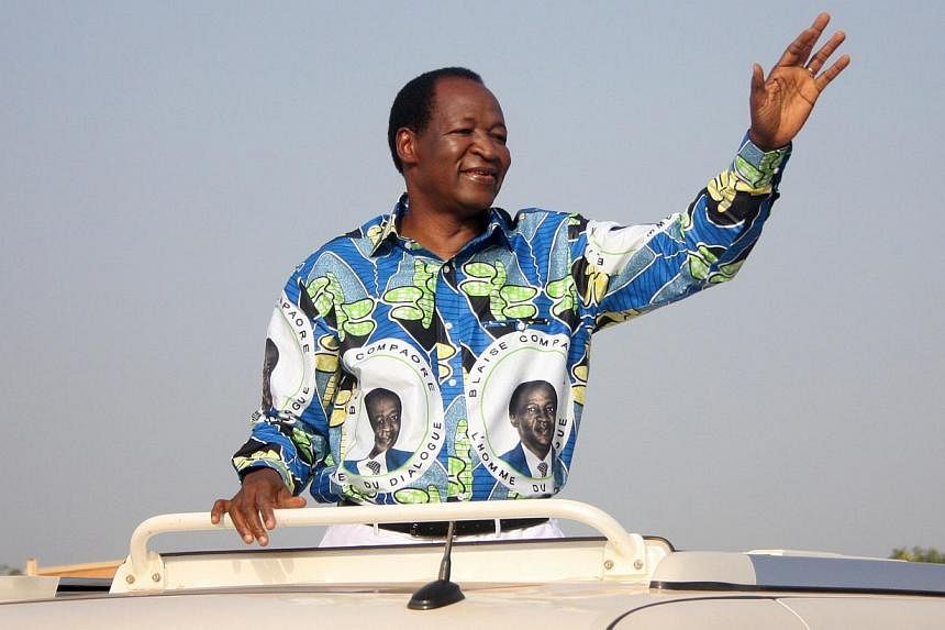 A file picture dated Oct 31, 2010 shows Blaise Compaore, Burkina Faso's now overthrown president,&nbsp;greeting supporters at the start of his electoral campaign.&nbsp;Violent clashes in Burkina Faso that led to the overthrow of Compaore&nbsp;are a s