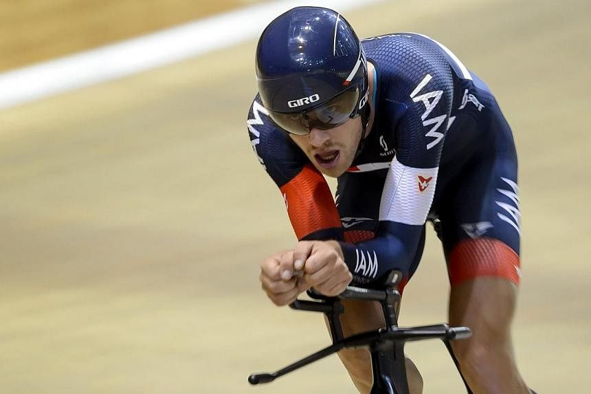 Austrian time-trial champion Matthias Brandle form Swiss team IAM cycling during his world hour record attempt at the UCI World Cycling Centre's velodrome in Aigle, southwestern Switzerland, on Oct 30, 2014. -- PHOTO: AFP