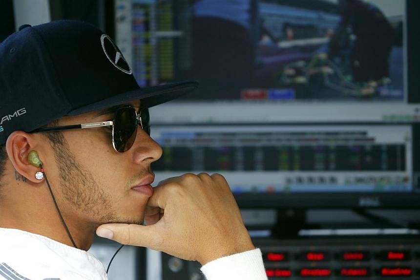 Lewis Hamilton (above, at the Russian Grand Prix on Oct 10 2014) said "it would suck big time" if he failed to win this year's world championship in Abu Dhabi because of F1's controversial decision to award double points at the final race. -- PHOTO: 